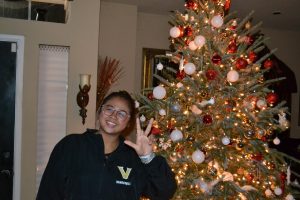 Hanna Pinang stands by a Christmas tree following her acceptance to Vanderbilt, as photographed on Dec. 17, 2024. (Courtesy of Hanna Pinang)