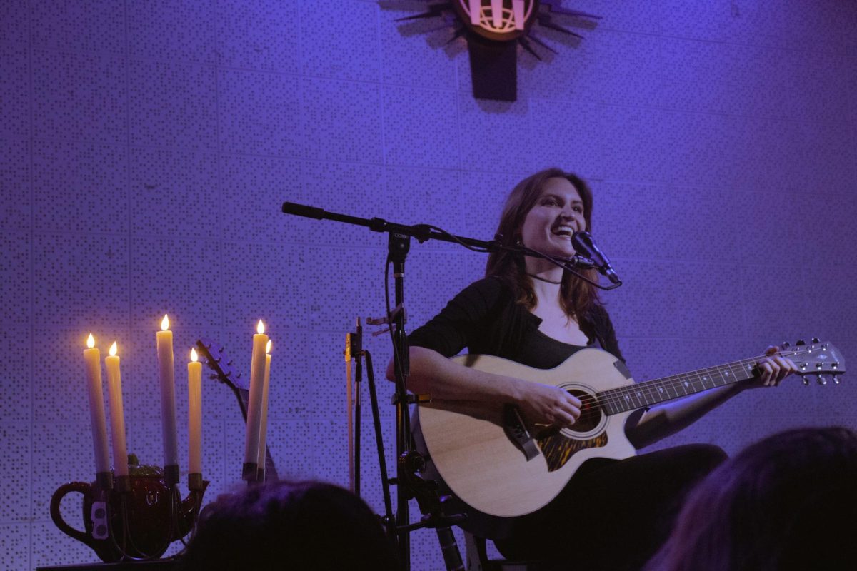 Katie Gavin smiles affectionately at her audience at The Blue Room, as photographed on Dec. 8, 2024. (Hustler Multimedia/Abbie Bobeck)