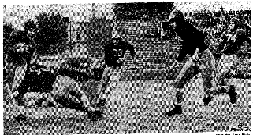 A photo pulled from the newspaper article published by The Atlanta Constitution on Oct. 19 1941. The photo depicts three Commodore players rushing at a Georgia Tech player who is returning a kick.