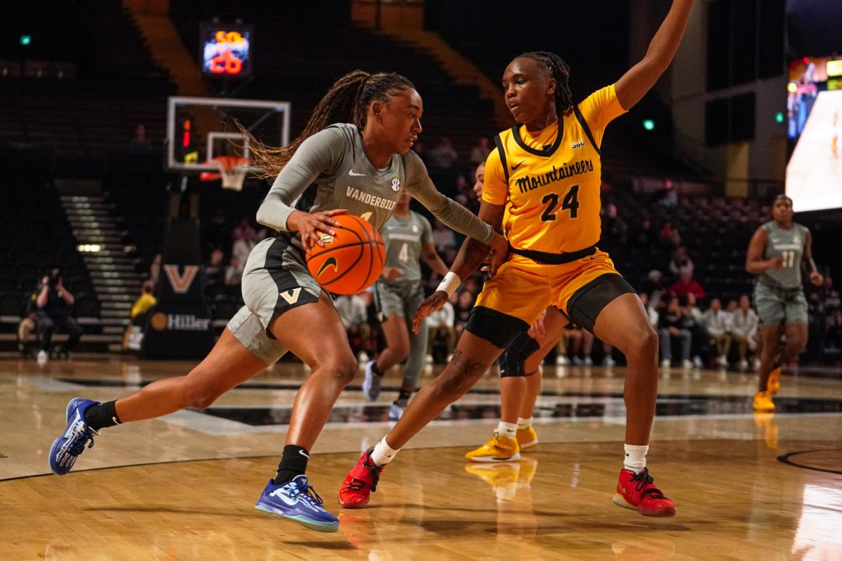 Mikayla Blakes handles the ball against an Appalachian State defender, as captured on December 1, 2024. (Hustler Multimedia/Savannah Walske)