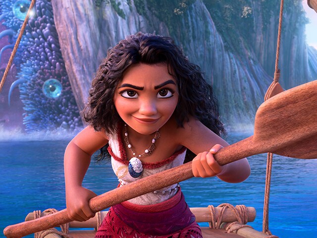 Moana holding an oar while in the ocean. (Courtesy of Disney Movies)