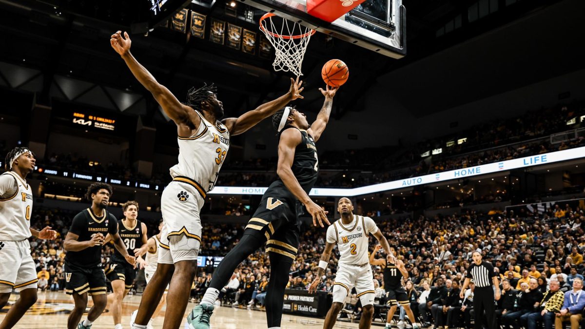 MJ Collins Jr. contorts for a layup through traffic, as photographed on Jan. 11, 2024. (Vanderbilt Athletics)