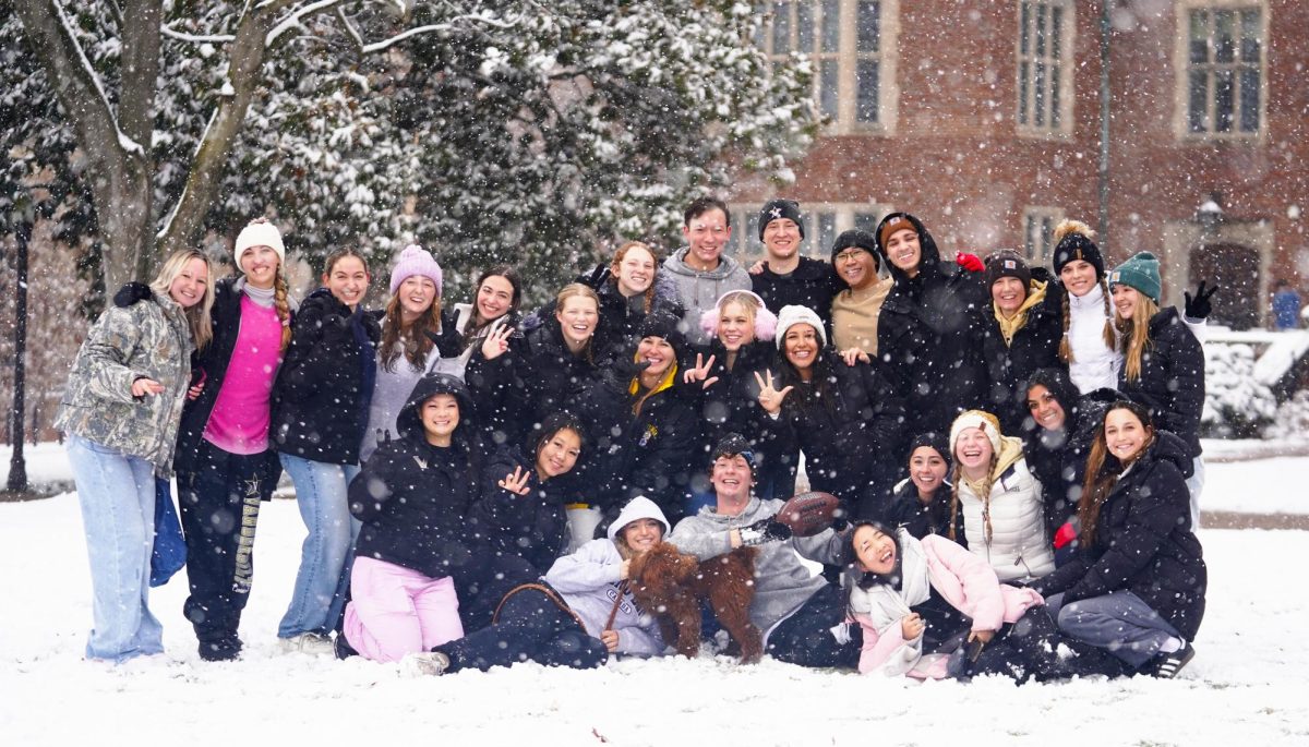 A group of students pose for a group photo in the snowfall, as photographed on Jan. 10, 2025. (Hustler Multimedia/George Albu)