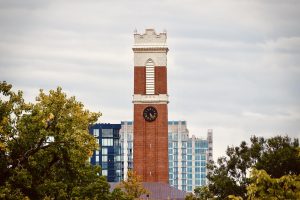 Kirkland clocktower emerges amid campus vegetation, as photographed on Sept. 13, 2024. (Hustler Multimedia/Royce Yang)