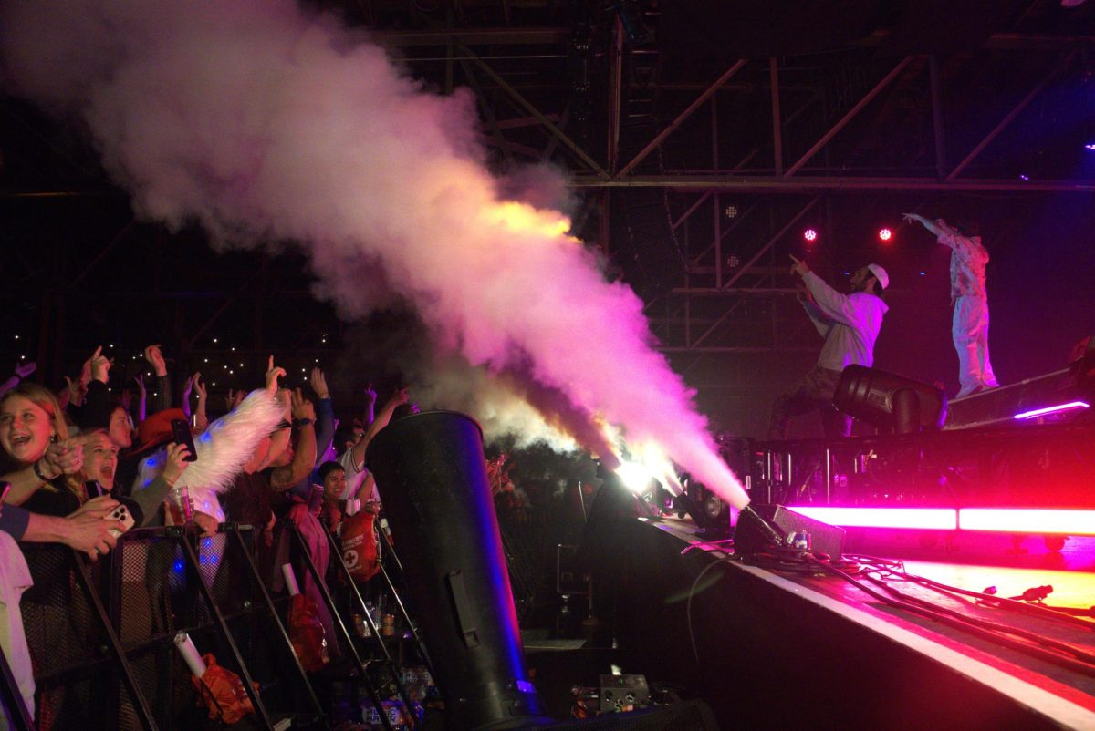 Two Friends dance and play on stage as smoke cannons erupt over cheering fans, as photographed on Feb. 15, 2025. (Hustler Multimedia/Jocelyn Ni)