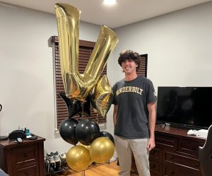 Newly admitted student Jacob Klein stands with Vanderbilt-themed balloons. (Courtesy of Jacob Klein)