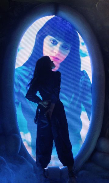 Tenenbaum stands in front of a projection of her face, as photographed on Oct. 8, 2025. (Hustler Multimedia/Alysia Shang) 