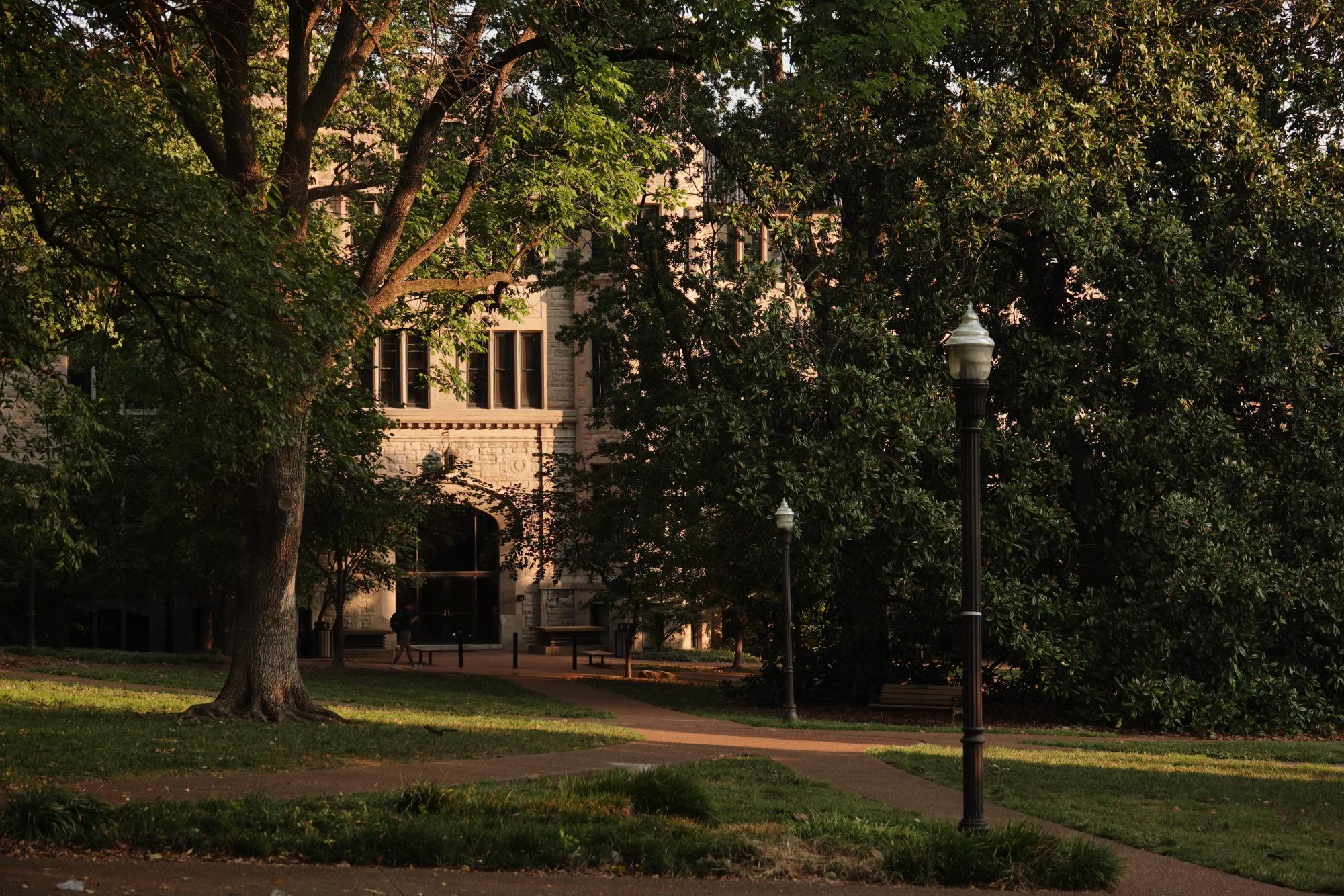 A student walks past Furman Hall on a sunny day, as photographed on Sept. 10, 2025. (Hustler Multimedia/Corey Lochan) 