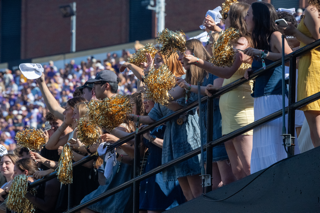 Fans cheer on Vanderbilt as they shake gold-colored pom-poms in the stands, as photographed on Oct. 18, 2025. (Hustler Multimedia/Jackson Blunt) 