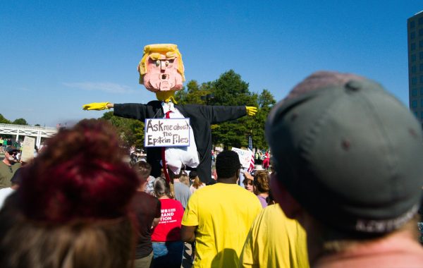 Papier-mâché model of Donald Trump stands amongst the crowd of No Kings protestors. A sign hanging around its neck that reads “Ask me about the Epstein Files,” as photographed on Oct. 17, 2025. (Hustler Multimedia/George Albu) 