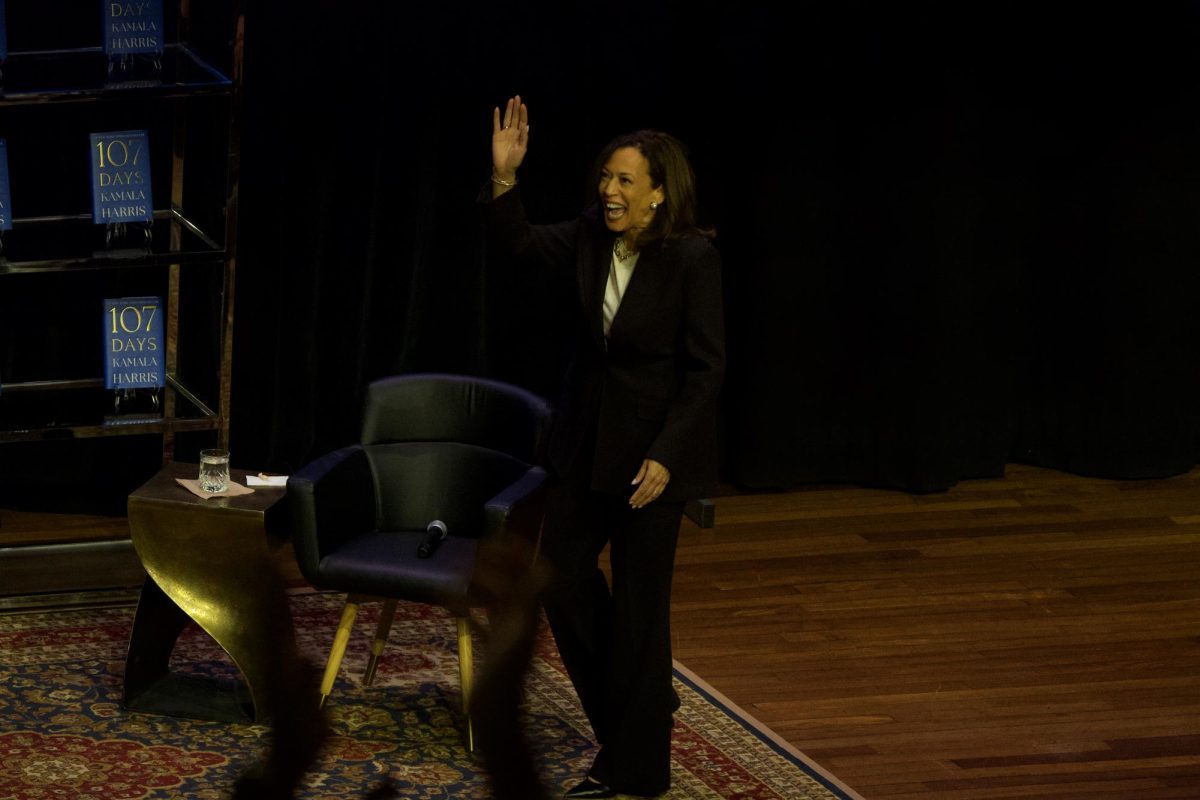 Former Vice President Kamala Harris waves to the audience as she steps on stage at Ryman Auditorium, as photographed on Nov. 18, 2025. (Hustler Multimedia/Alex Brodeur)