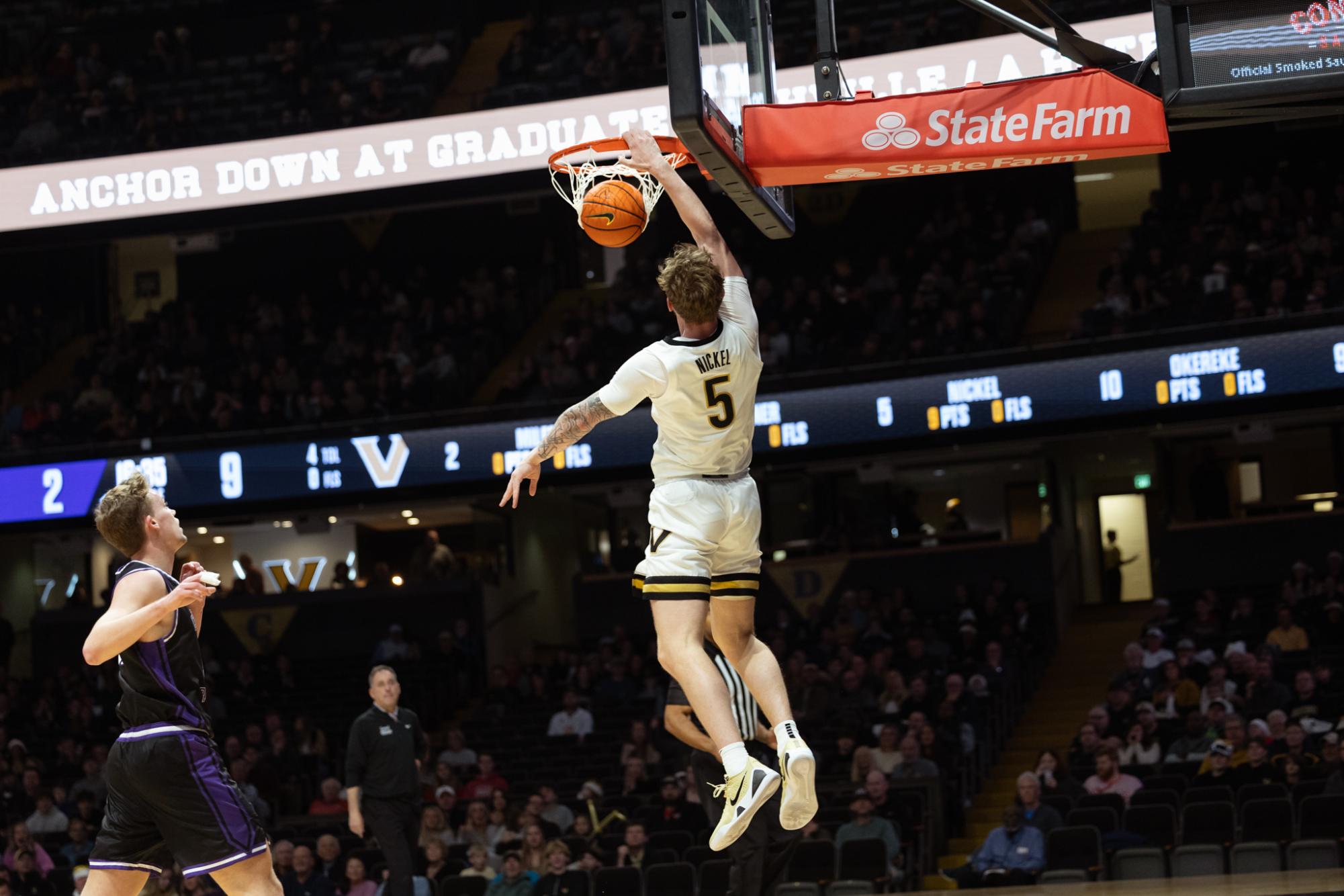 Tyler Nickel finishes a slam dunk, as photographed on Dec. 3, 2025. (Hustler Multimedia/Abbie Bobeck).