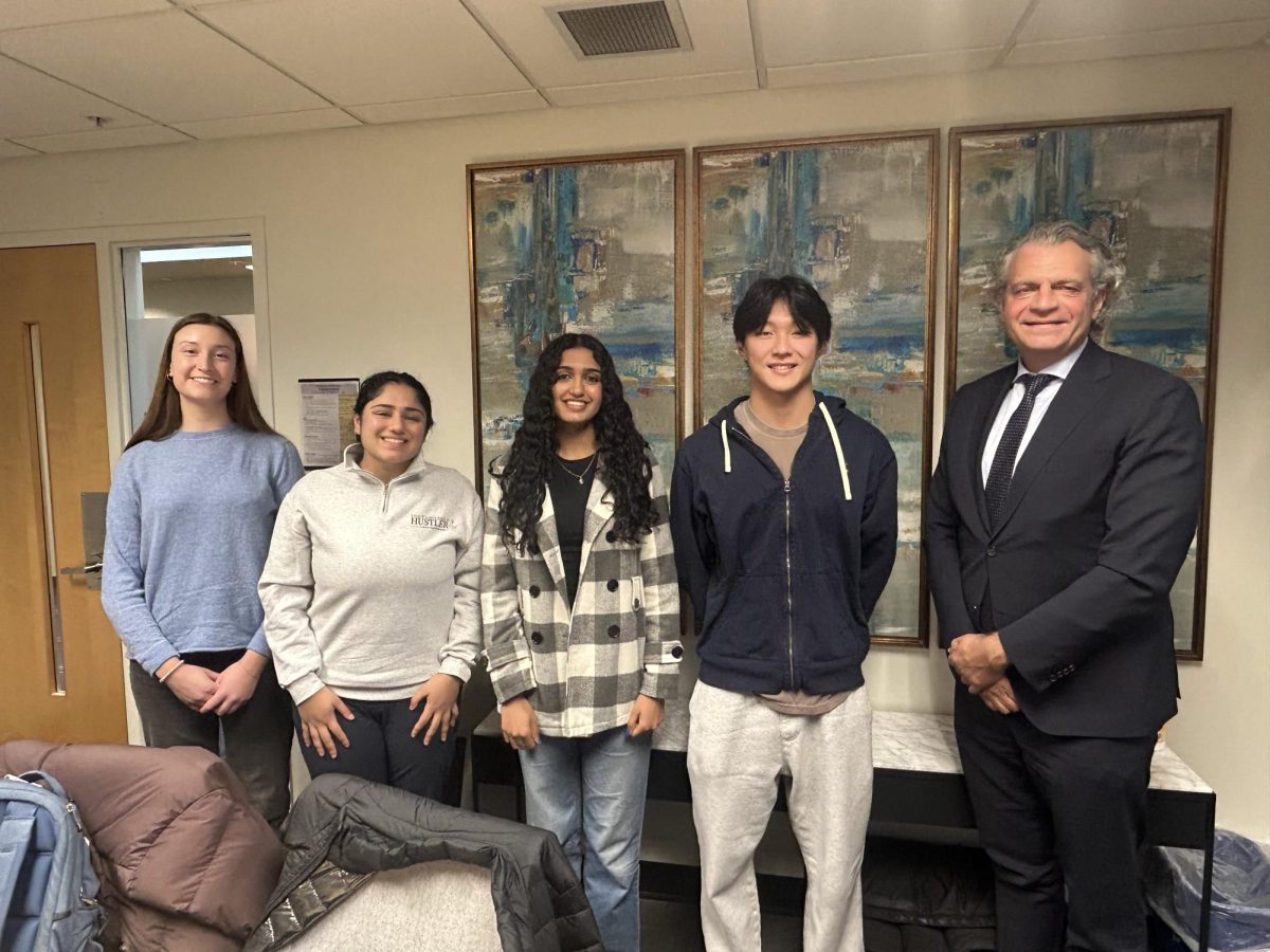 From left to right, Charlotte Castle, Rhea Patney, Swarada Kulkarni, Vincent Xu and Chancellor Daniel Diermeier, as photographed on Dec. 4, 2025. (Photo courtesy of Julia Jordan) 