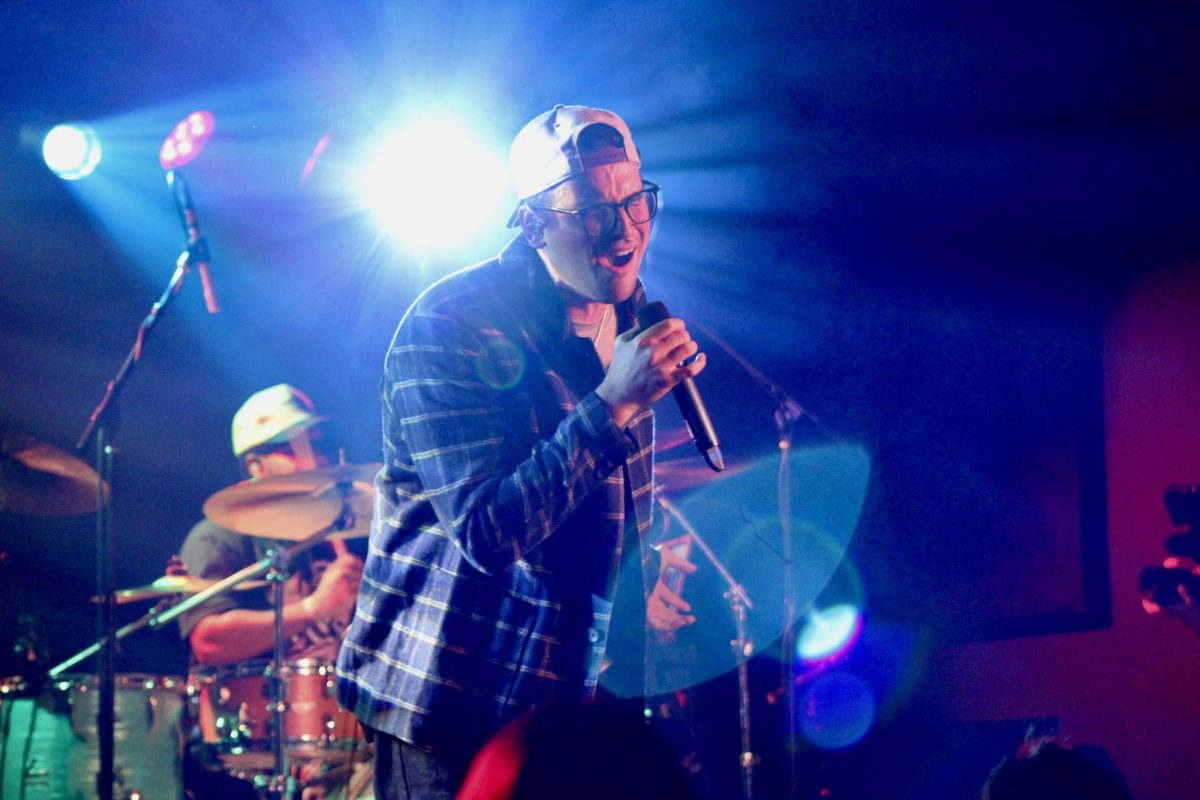 Stanaj sings into the mic at The Basement East, as photographed Jan. 22, 2026. (Hustler Multimedia/Paula Legisima) 