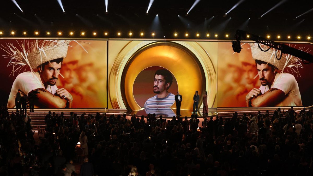 Bad Bunny accepts the award for Album of the Year for "Debi Tirar Mas Fotos" as presenter Harry Styles looks on during the 68th Annual Grammy Awards in Los Angeles, California, U.S., February 1, 2026. REUTERS/Daniel Cole