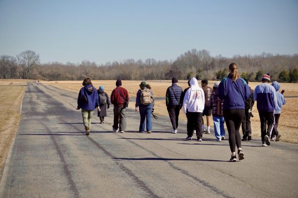 Bird Club members walk along a former taxiway at Cornelia Fort Airpark, as photographed Feb. 7, 2026. (Hustler Multimedia/Royce Yang)