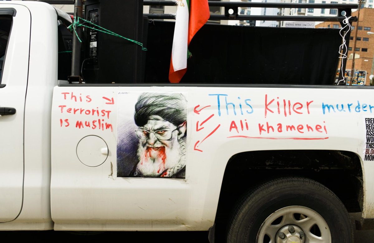 Demonstrators stood in front of the Frist Art Museum Feb. 14 to call for support for freedom in Iran, calling on President Trump to intervene.