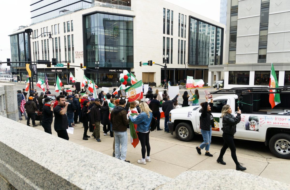 Demonstrators stood in front of the Frist Art Museum Feb. 14 to call for support for freedom in Iran, calling on President Trump to intervene.