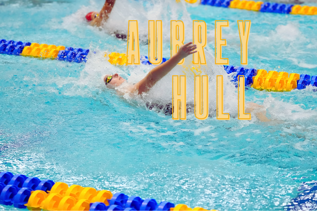 Aubrey Hull swims the backstroke with her name in bold letters in the foreground. (Hustler Multimedia/Sragvi Dara)