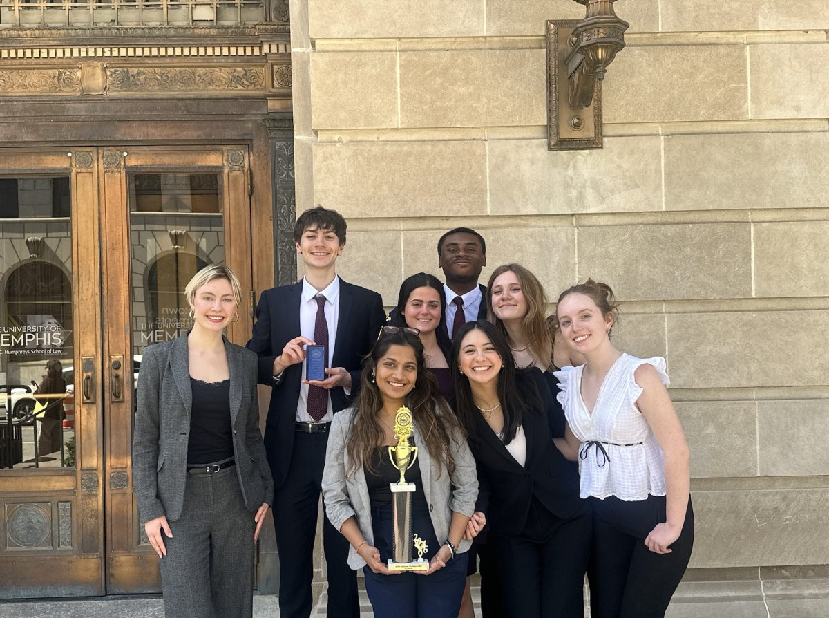 Vanderbilt Mock Trial’s A Team poses with their trophy after qualifying for Nationals at the Opening Round Championship Series, as photographed March 22. (Photo courtesy of Anavi Jain)