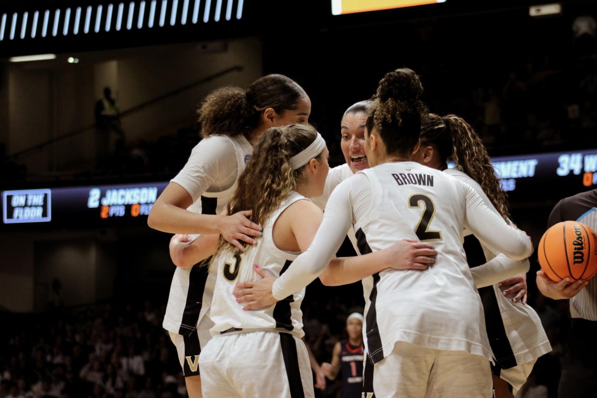 Women’s basketball players huddle on the court, as photographed March 23, 2026. (Hustler Multimedia/Rachel Loomis)