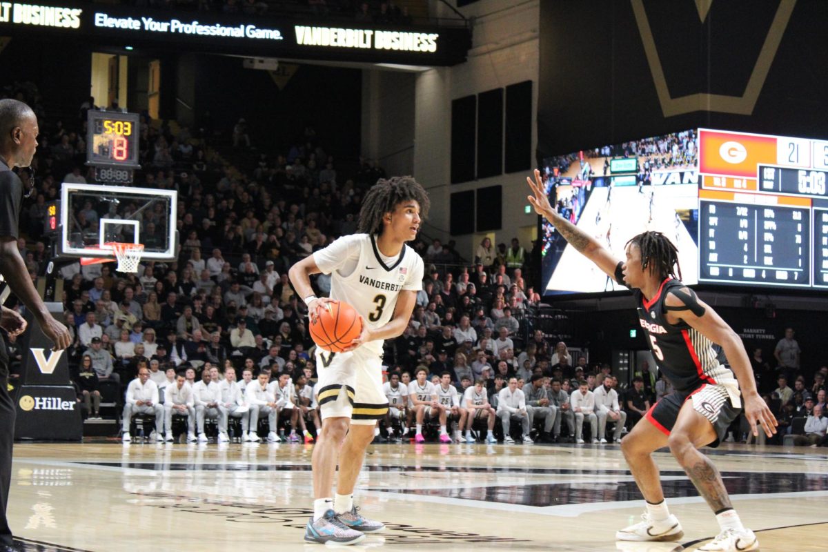 Tyler Tanner holds the basketball while looking towards the basket off-frame, as photographed Feb. 25, 2026. (Hustler Multimedia/Rachel Loomis) 
