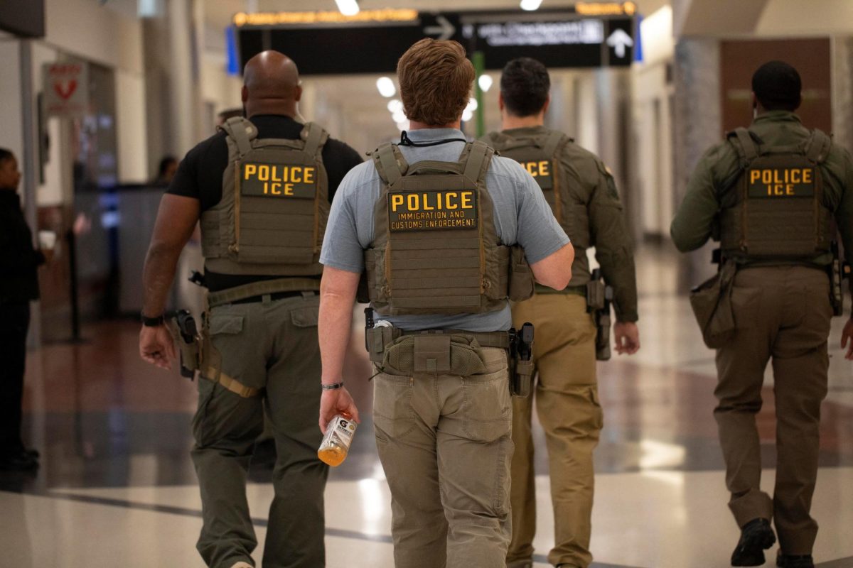 ICE agents walk through Hartsfield-Jackson Atlanta International Airport in Atlanta, Georgia, as photographed March 24, 2026. (Photo Courtesy of REUTERS/Alyssa Pointer)