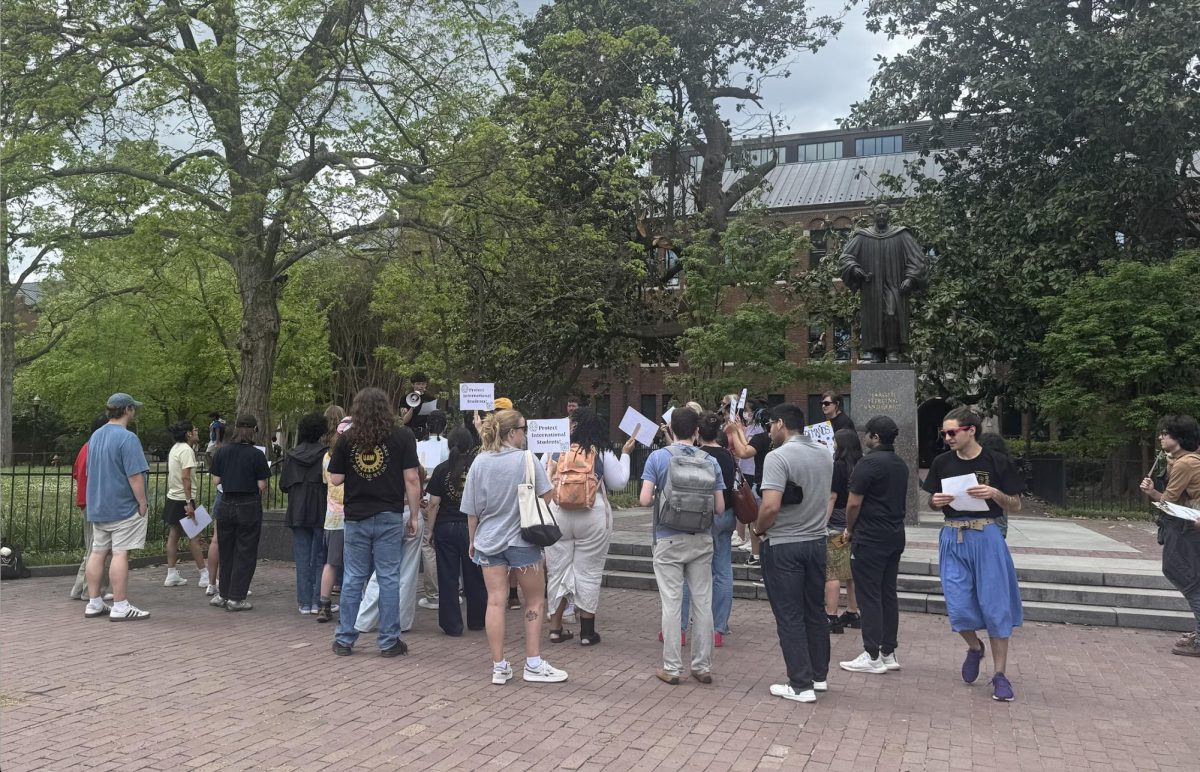 Vanderbilt Graduate Workers United holds signs in front of the Buttrick statue for the “Meet this moment” rally, as photographed April 14, 2026. (Hustler Multimedia/Chris Lee)