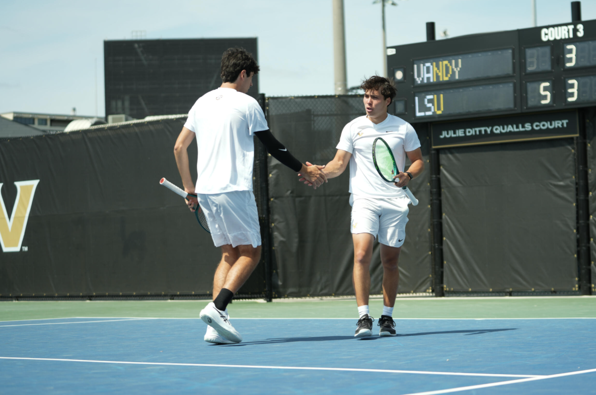 Two Vanderbilt players high five after a point, as photographed March 29, 2026. (Vanderbilt Athletics) 