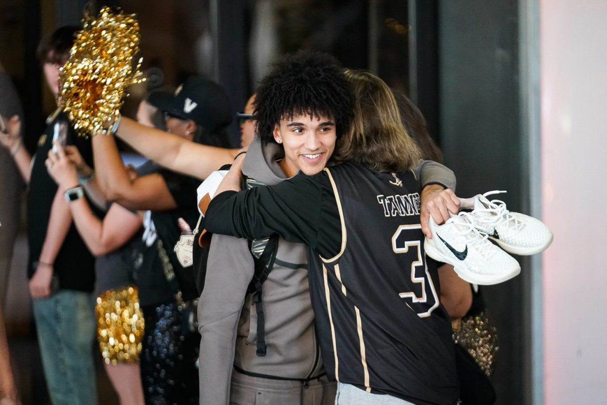 Tyler Tanner shares a hug, as photographed March 21, 2026. (Hustler Multimedia/Michael Tung)