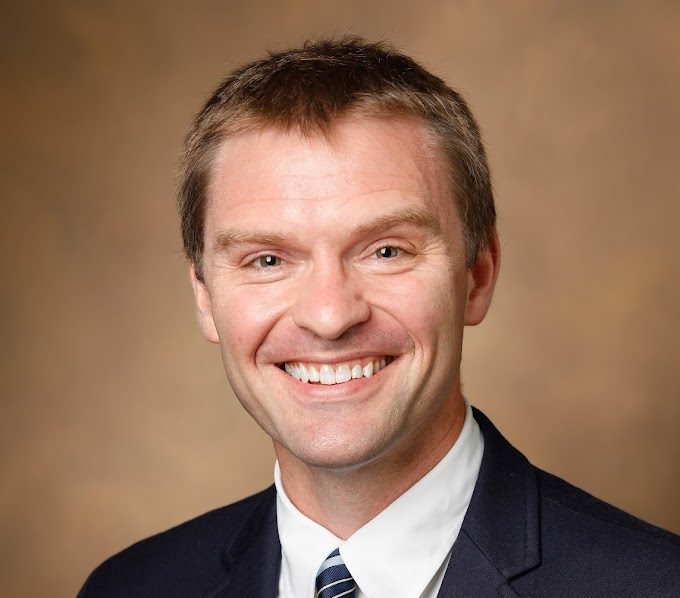 Dr. Justin Gregory smiles at the camera. (Photo courtesy of Megan Ball)