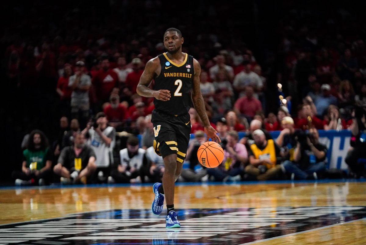 Duke Miles takes the ball up court, as photographed March 21, 2026. (Hustler Multimedia/Micheal Tung)