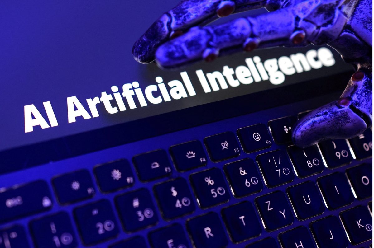 Words "AI Artificial Inteligence", keyboard, and a robotic hand in this illustration taken June 5, 2026. REUTERS/Dado Ruvic/Illustration